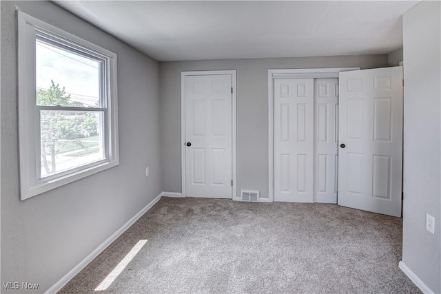16005 Mendota Ave, Maple Heights, OH 44137 - unfurnished bedroom featuring carpet and a closet