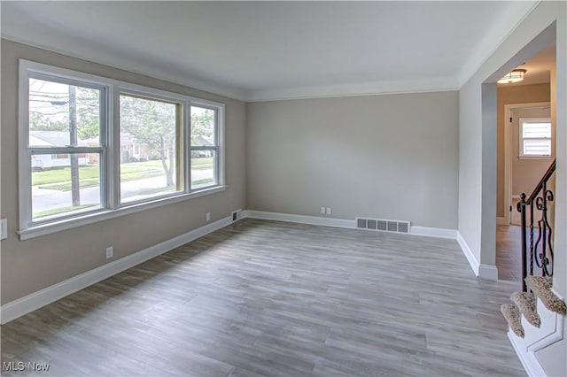 16005 Mendota Ave, Maple Heights, OH 44137 - spare room with wood finished floors, stairs, and ornamental molding