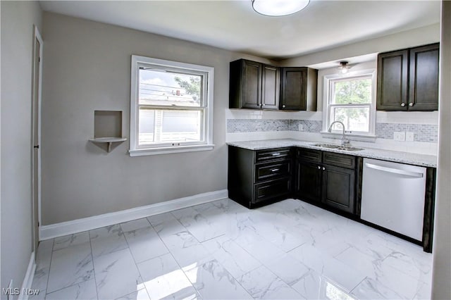 16005 Mendota Ave, Maple Heights, OH 44137 - kitchen with stainless steel dishwasher, light marble finish floors, decorative backsplash, light stone counters, and dark brown cabinets
