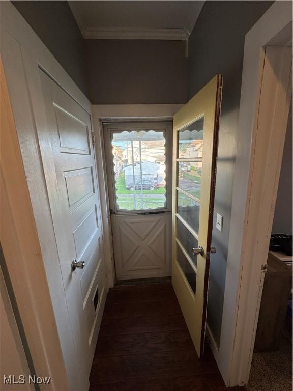 3868 Adams Ave, Shadyside, OH 43947 - doorway with crown molding and dark wood-type flooring