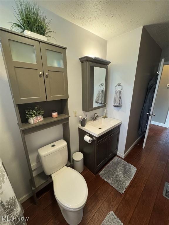 3868 Adams Ave, Shadyside, OH 43947 - bathroom with hardwood / wood-style flooring, vanity, and a textured ceiling