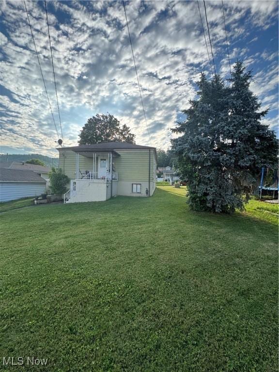 3868 Adams Ave, Shadyside, OH 43947 - view of grassy yard with a trampoline