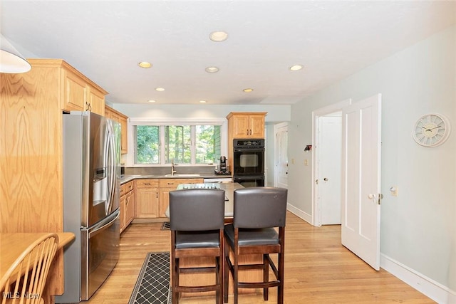 1539 Compton Rd, Cleveland Heights, OH 44118 - kitchen with stainless steel refrigerator with ice dispenser, light brown cabinets, light wood-type flooring, and recessed lighting
