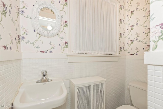 1539 Compton Rd, Cleveland Heights, OH 44118 - half bath with wallpapered walls, tile walls, wainscoting, and radiator heating unit