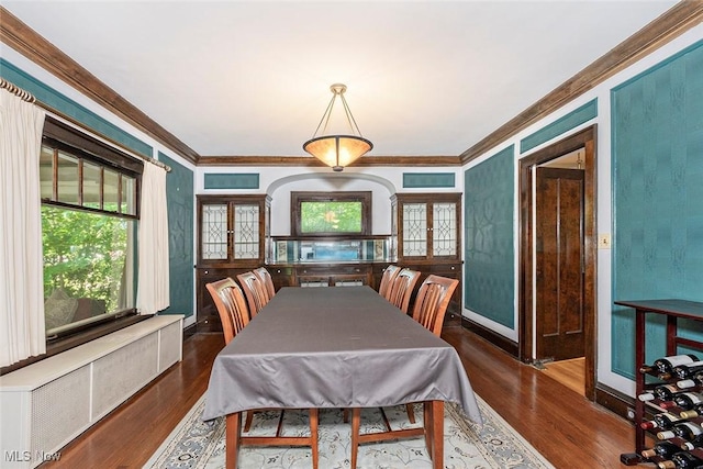 1539 Compton Rd, Cleveland Heights, OH 44118 - dining space with radiator heating unit, ornamental molding, and wood finished floors