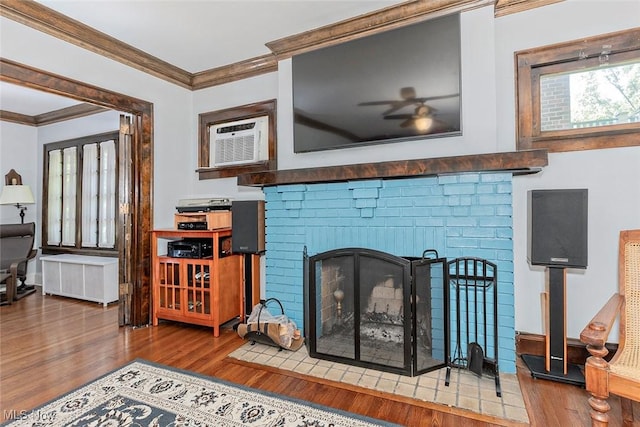 1539 Compton Rd, Cleveland Heights, OH 44118 - detailed view of ornamental molding, a brick fireplace, a ceiling fan, wood finished floors, and radiator heating unit