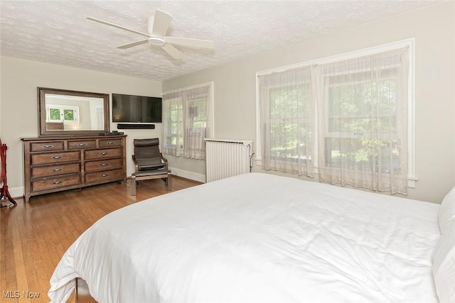 1539 Compton Rd, Cleveland Heights, OH 44118 - bedroom with wood finished floors, a textured ceiling, and a ceiling fan