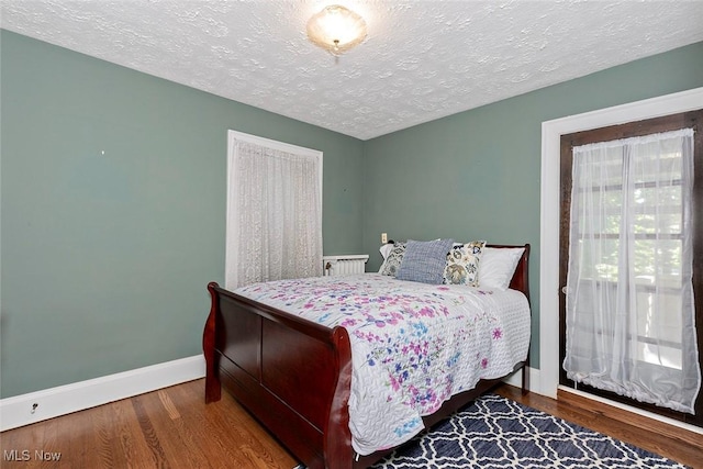 1539 Compton Rd, Cleveland Heights, OH 44118 - bedroom with a textured ceiling and wood finished floors