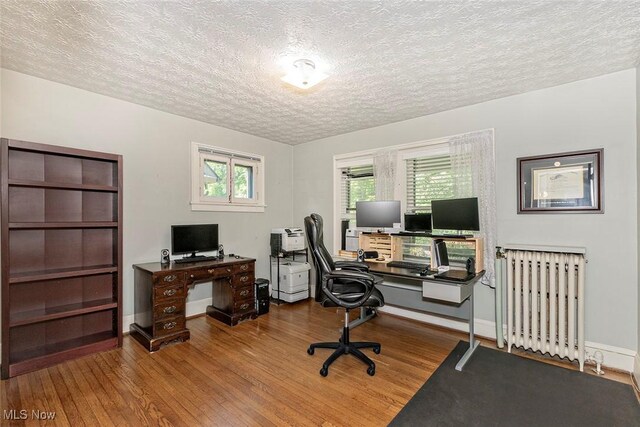 1539 Compton Rd, Cleveland Heights, OH 44118 - office area featuring radiator, wood finished floors, and a textured ceiling