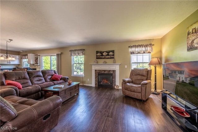 785 Cambridge Ct, Kent, OH 44240 - living area featuring dark wood-type flooring, a tiled fireplace, and a chandelier