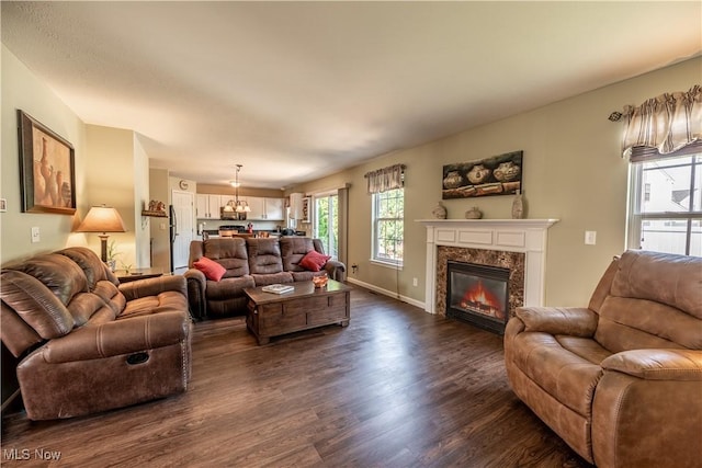 785 Cambridge Ct, Kent, OH 44240 - living room with dark wood-style flooring, a high end fireplace, and a chandelier