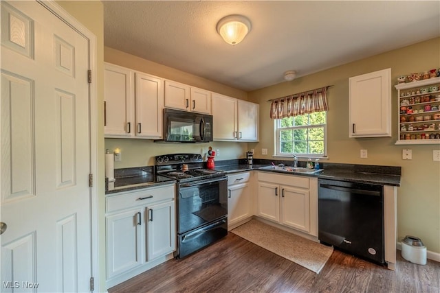 785 Cambridge Ct, Kent, OH 44240 - kitchen with black appliances, dark countertops, white cabinets, and dark wood-style flooring