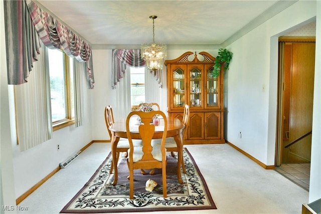 3787 Helsey Fusselman Rd, Southington, OH 44470 - dining room featuring a chandelier and light carpet