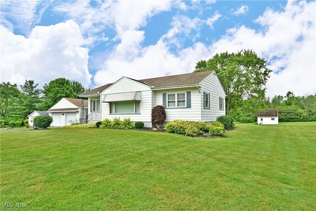 3787 Helsey Fusselman Rd, Southington, OH 44470 - view of front facade featuring a garage, a front lawn, and a storage shed