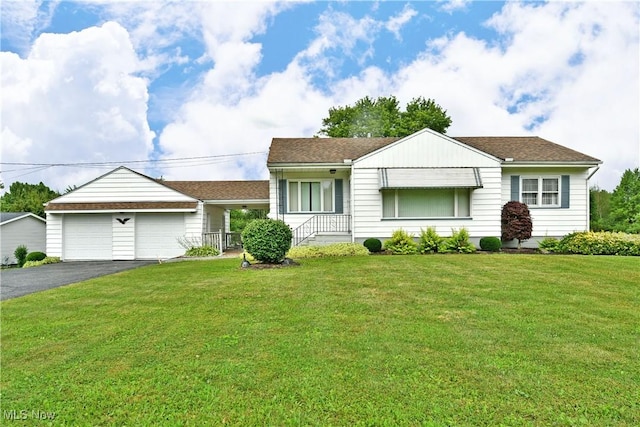 3787 Helsey Fusselman Rd, Southington, OH 44470 - view of front of home featuring a front lawn, driveway, and a garage