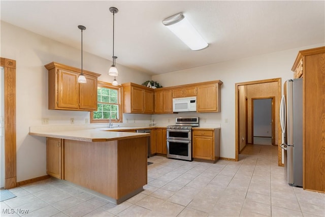3342 Ramsgate St NW, North Canton, OH 44720 - kitchen with stainless steel appliances, a peninsula, light countertops, hanging light fixtures, and light tile patterned floors