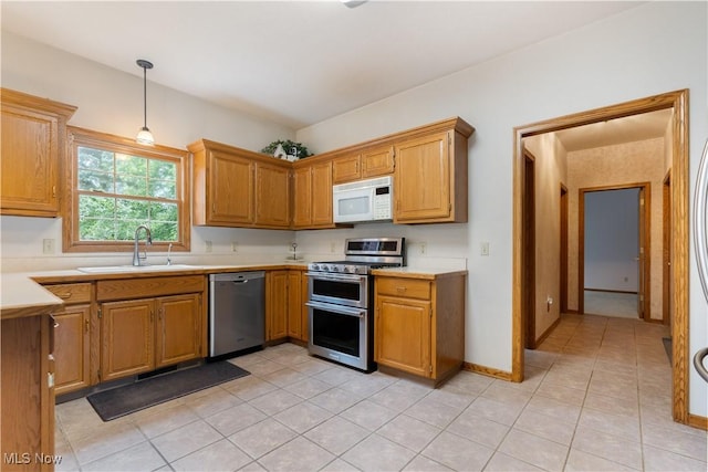3342 Ramsgate St NW, North Canton, OH 44720 - kitchen featuring stainless steel appliances, light tile patterned floors, and light countertops