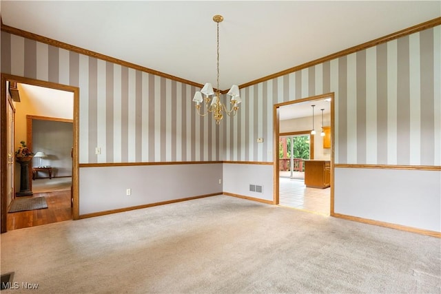 3342 Ramsgate St NW, North Canton, OH 44720 - carpeted spare room featuring crown molding and a chandelier