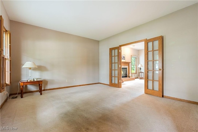 3342 Ramsgate St NW, North Canton, OH 44720 - carpeted spare room featuring french doors and baseboards