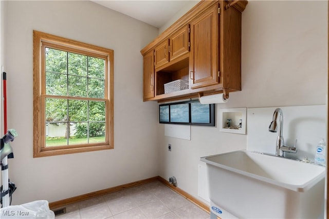 3342 Ramsgate St NW, North Canton, OH 44720 - laundry room featuring cabinet space, electric dryer hookup, washer hookup, and light tile patterned floors