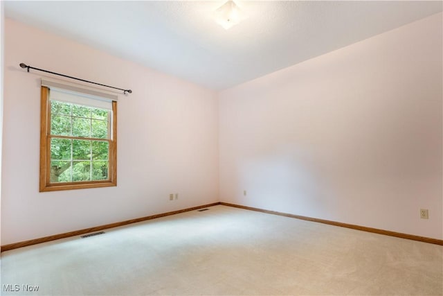 3342 Ramsgate St NW, North Canton, OH 44720 - unfurnished room with light colored carpet and baseboards