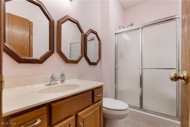 3342 Ramsgate St NW, North Canton, OH 44720 - bathroom with vanity, a stall shower, and tile patterned flooring