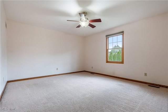 3342 Ramsgate St NW, North Canton, OH 44720 - empty room featuring carpet floors and ceiling fan
