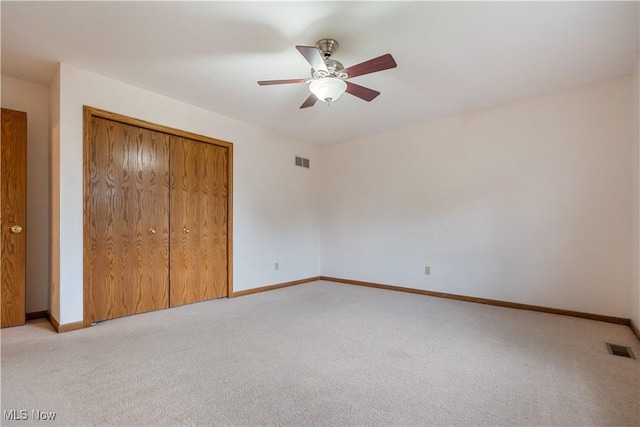 3342 Ramsgate St NW, North Canton, OH 44720 - unfurnished bedroom with light carpet, a closet, and a ceiling fan