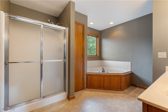 3342 Ramsgate St NW, North Canton, OH 44720 - full bath with a shower stall, vanity, a bath, recessed lighting, and tile patterned floors