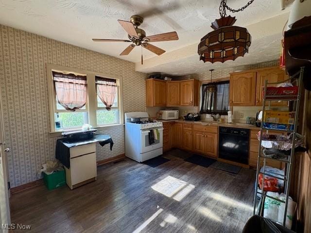 19510 Gardenview Dr, Maple Heights, OH 44137 - kitchen featuring white appliances, dark wood-type flooring, light countertops, ceiling fan, and brown cabinetry