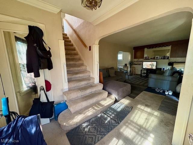 19510 Gardenview Dr, Maple Heights, OH 44137 - stairs with arched walkways, carpet floors, and ornamental molding