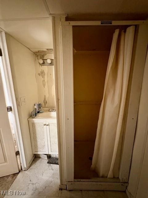 19510 Gardenview Dr, Maple Heights, OH 44137 - bathroom featuring vanity, a shower stall, and marble finish floors