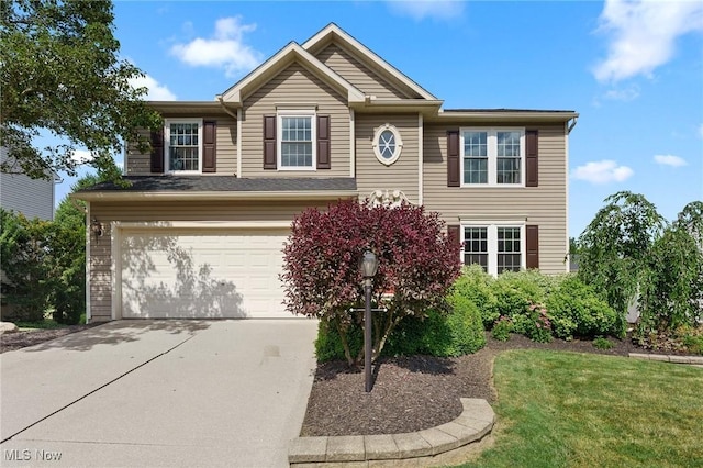 184 Creekledge Ln, Copley, OH 44321 - view of front of property featuring a garage, driveway, and a front lawn