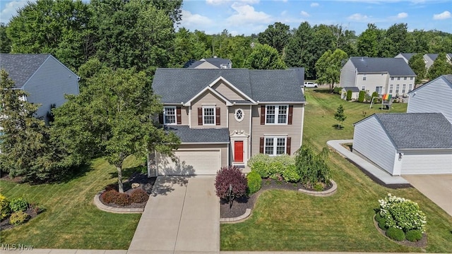 184 Creekledge Ln, Copley, OH 44321 - traditional home with driveway, a garage, a front lawn, and roof with shingles