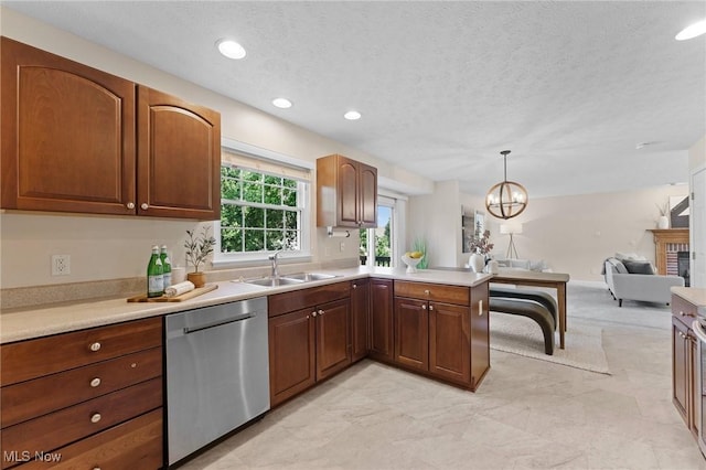 184 Creekledge Ln, Copley, OH 44321 - kitchen with stainless steel dishwasher, light countertops, open floor plan, a textured ceiling, and recessed lighting