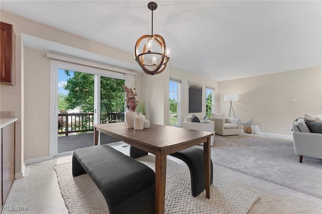 184 Creekledge Ln, Copley, OH 44321 - dining area with a chandelier and light carpet