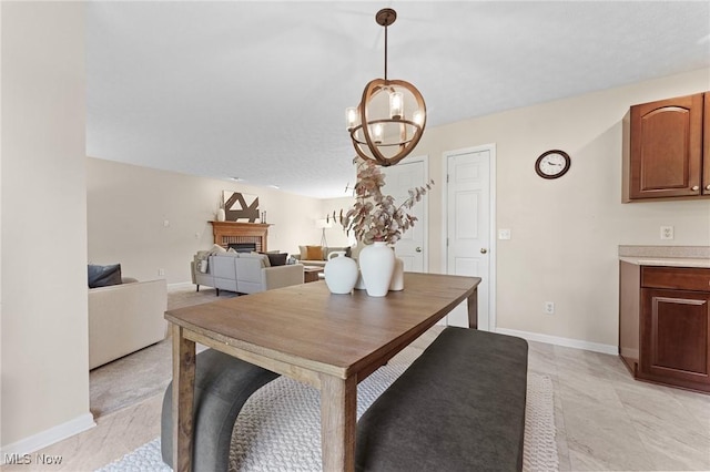 184 Creekledge Ln, Copley, OH 44321 - dining space featuring a fireplace and a chandelier