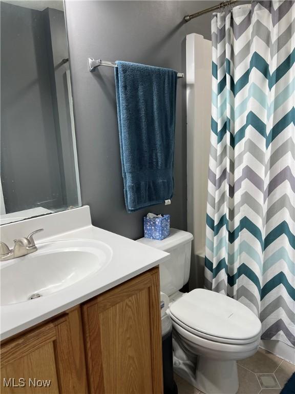 116 Ledgestone Ct, Berea, OH 44017 - bathroom with vanity, curtained shower, and tile patterned flooring