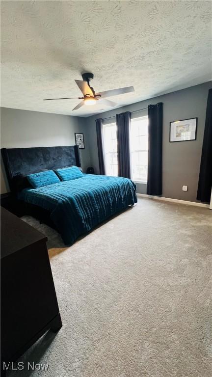 116 Ledgestone Ct, Berea, OH 44017 - bedroom featuring a textured ceiling, carpet flooring, and ceiling fan