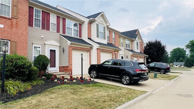 116 Ledgestone Ct, Berea, OH 44017 - view of property with brick siding, an attached garage, driveway, a front yard, and a residential view