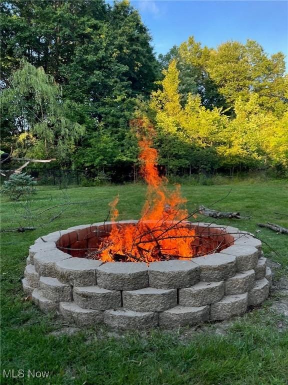 4575 Fishcreek Rd, Stow, OH 44224 - view of grassy yard featuring an outdoor fire pit