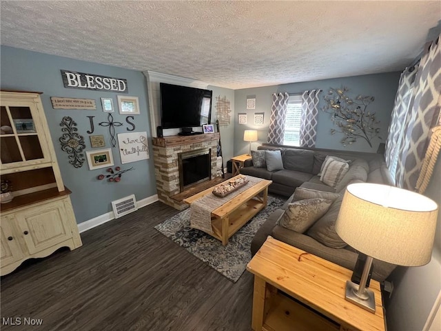 4575 Fishcreek Rd, Stow, OH 44224 - living area with a textured ceiling, dark wood finished floors, and a stone fireplace