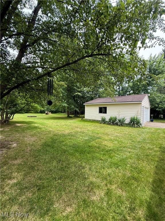 4575 Fishcreek Rd, Stow, OH 44224 - view of green lawn with an outdoor structure and driveway