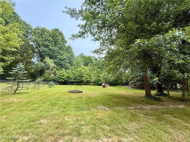 4575 Fishcreek Rd, Stow, OH 44224 - view of yard featuring a fire pit and a view of trees