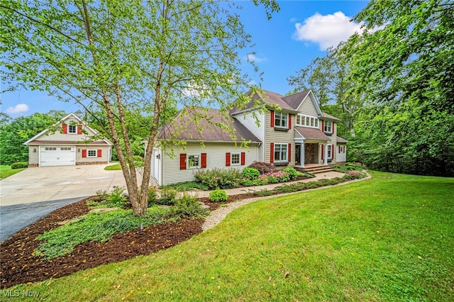 11275 Beechnut Ln, Chardon, OH 44024 - view of front of home featuring concrete driveway, a garage, and a front lawn