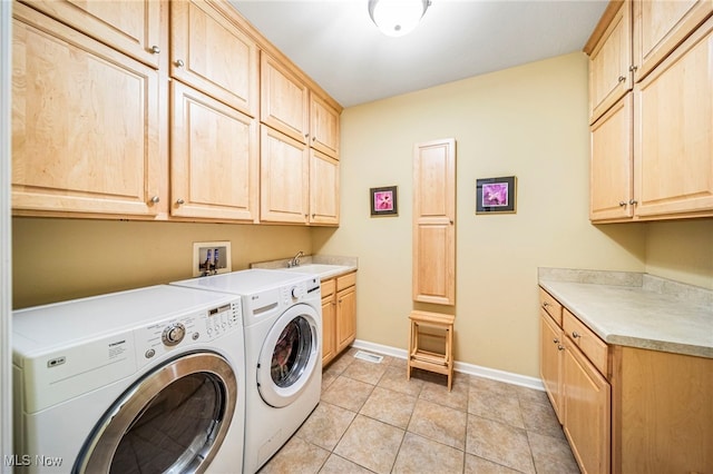 11275 Beechnut Ln, Chardon, OH 44024 - washroom with cabinet space, washing machine and clothes dryer, and light tile patterned flooring