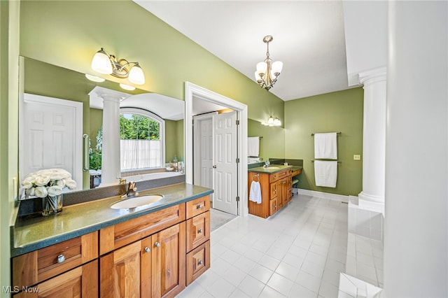 11275 Beechnut Ln, Chardon, OH 44024 - bathroom featuring decorative columns, tile patterned flooring, two vanities, and a chandelier