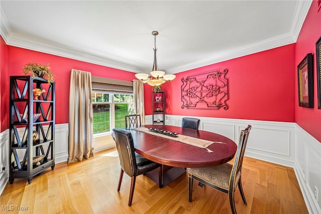 11275 Beechnut Ln, Chardon, OH 44024 - dining area with wainscoting, ornamental molding, and light wood finished floors