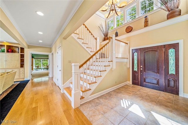 11275 Beechnut Ln, Chardon, OH 44024 - entryway with a chandelier, stairway, crown molding, and recessed lighting