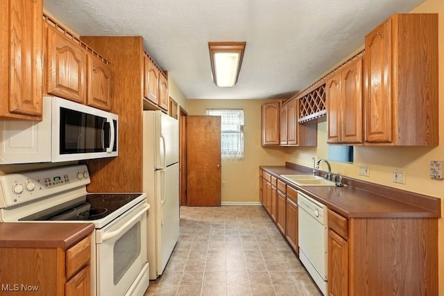 3692 Orchard St, Mogadore, OH 44260 - kitchen featuring white appliances, dark countertops, and brown cabinets